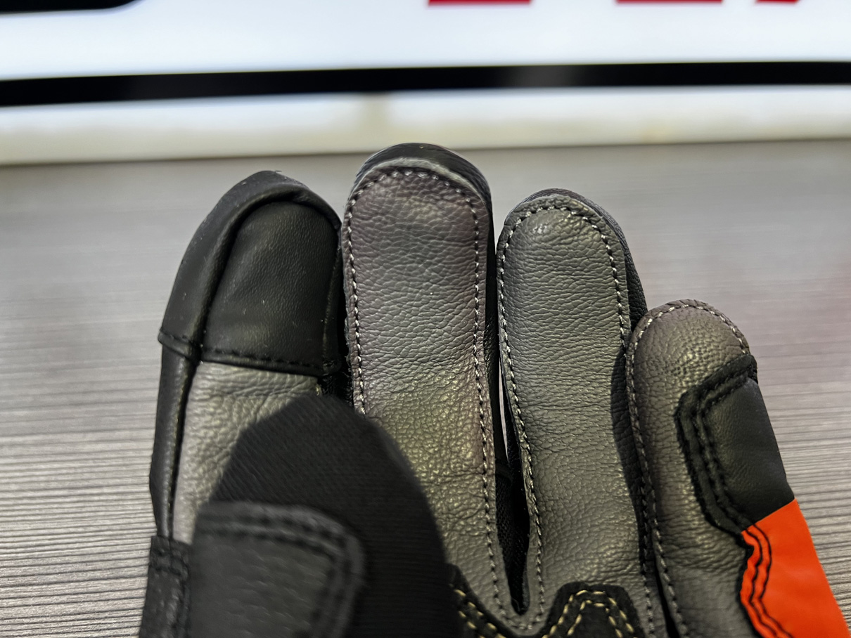 Dedo táctil guante moto